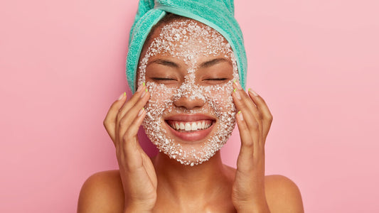 woman using facial scrub representing over exfoliation skin damage and skincare mistakes