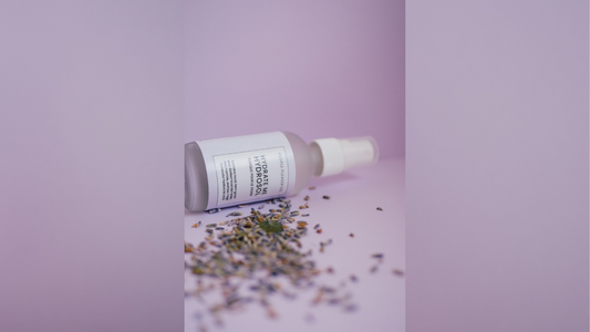 People Pleaser Co. Hydrate Me Hydrosol bottle with dried lavender containing niacinamide and hyaluronic acid for hydrated glowing skin