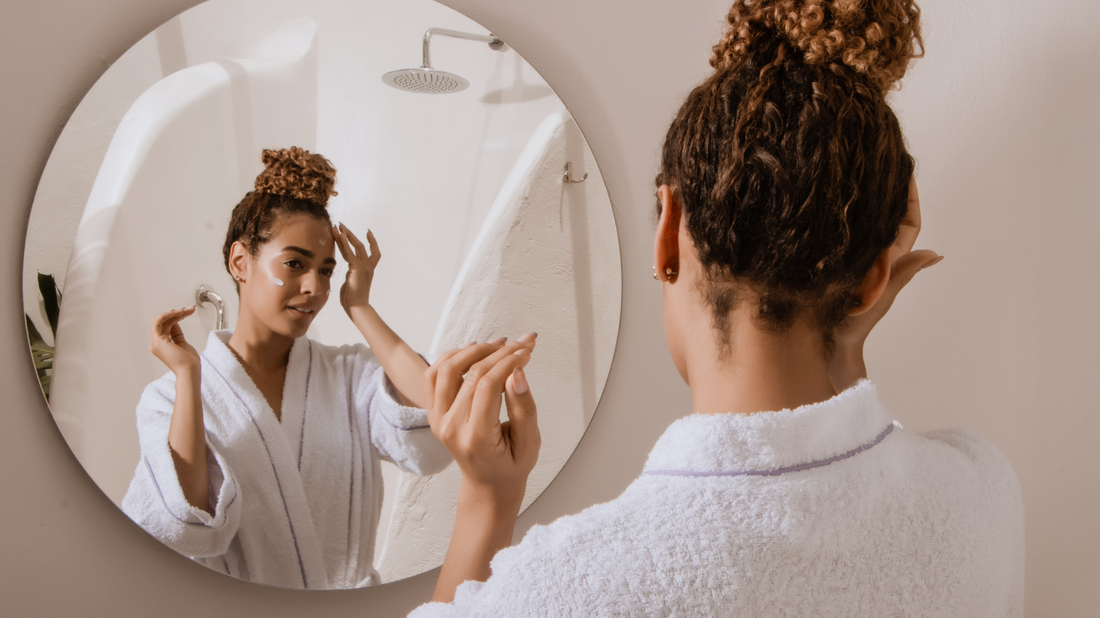 Woman looking in mirror worries about skincare mistakes